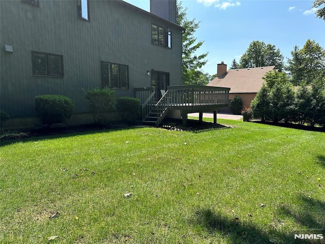 view of yard with a deck