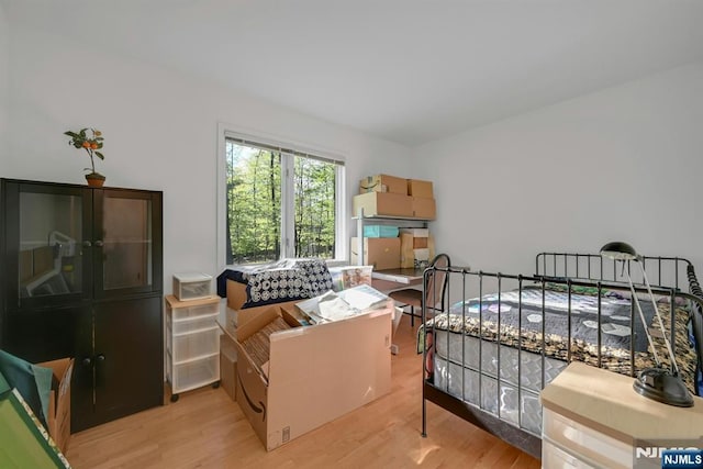 bedroom with light wood-style floors