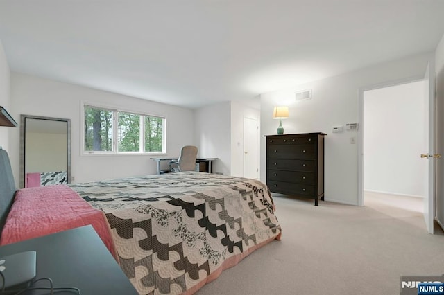 bedroom featuring visible vents and carpet