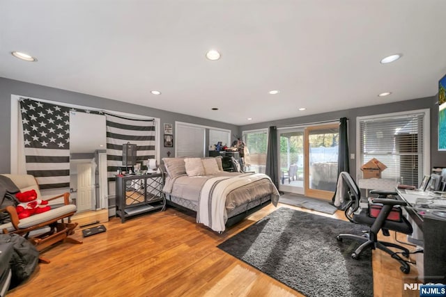 bedroom with access to outside, recessed lighting, and light wood-style flooring