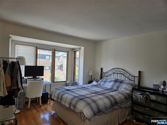 bedroom featuring wood finished floors