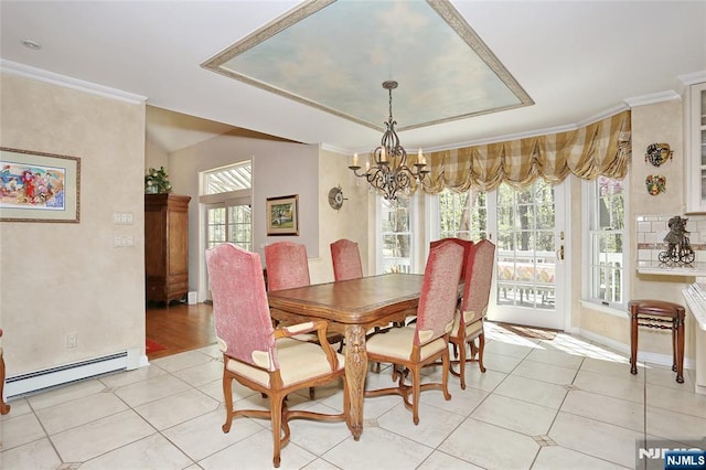 dining room featuring a baseboard heating unit, a chandelier, ornamental molding, light tile patterned floors, and lofted ceiling