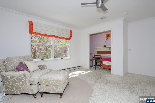 living area featuring baseboard heating, ornamental molding, carpet, a desk, and ceiling fan