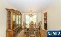 dining space featuring a chandelier