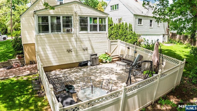 back of house with a patio area