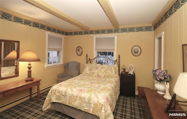 bedroom featuring dark carpet, a baseboard radiator, and beam ceiling