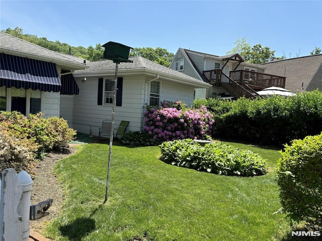view of side of home featuring a yard