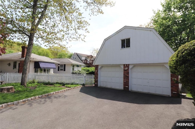 detached garage with fence