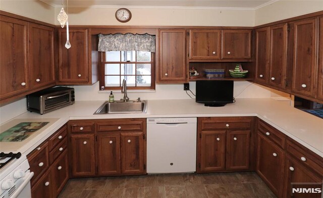 kitchen featuring a sink, white appliances, light countertops, a toaster, and ornamental molding