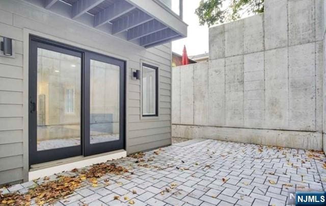 view of patio featuring fence