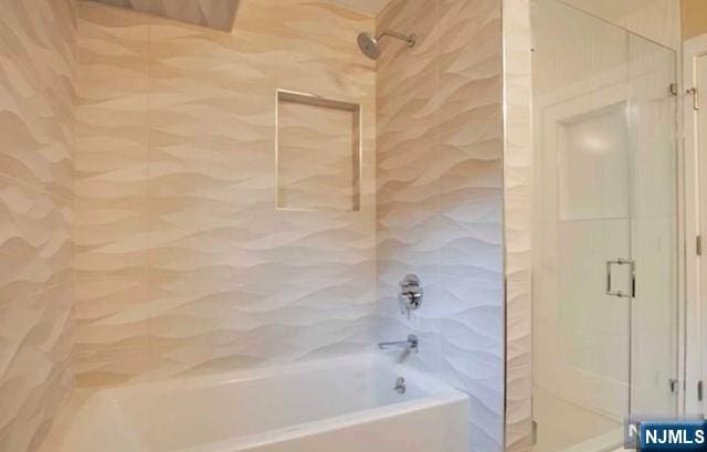 bathroom featuring enclosed tub / shower combo