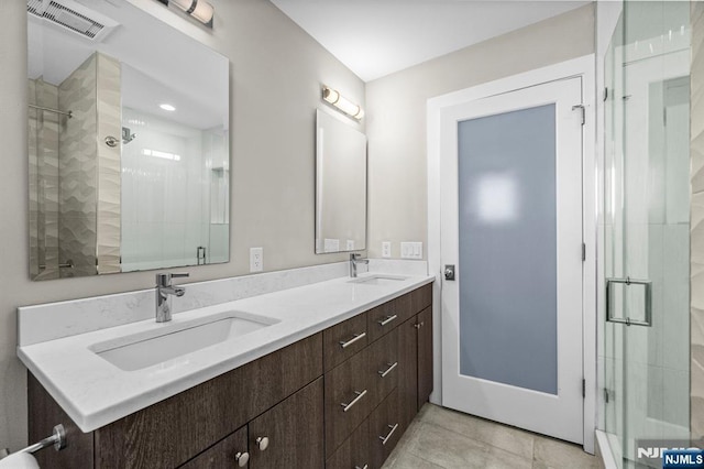 746 Undercliff Unit A, Edgewater, NJ 07020 - bathroom with a stall shower, double vanity, and tile patterned flooring