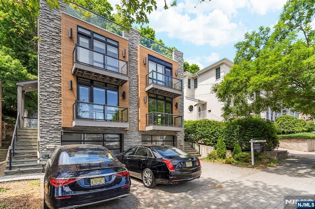 746 Undercliff Unit A, Edgewater, NJ 07020 - view of front of home featuring stairway and stone siding