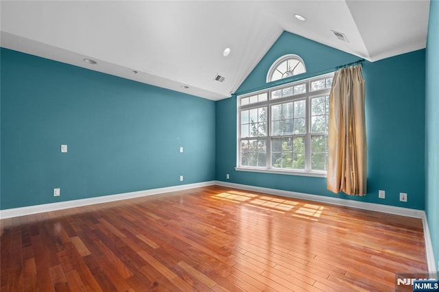 202 Blue Heron Dr, Secaucus, NJ 07094 - unfurnished room with visible vents, baseboards, lofted ceiling, and hardwood / wood-style floors