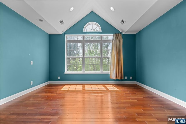 202 Blue Heron Dr, Secaucus, NJ 07094 - spare room featuring baseboards, lofted ceiling, wood finished floors, and visible vents