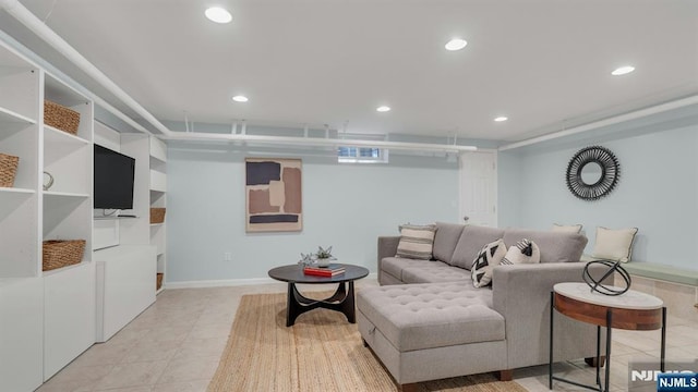 living room featuring light tile patterned flooring, baseboards, and recessed lighting