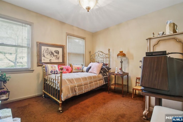 carpeted bedroom with baseboards