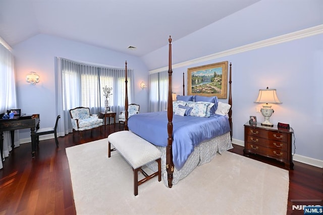 bedroom with visible vents, wood finished floors, and lofted ceiling