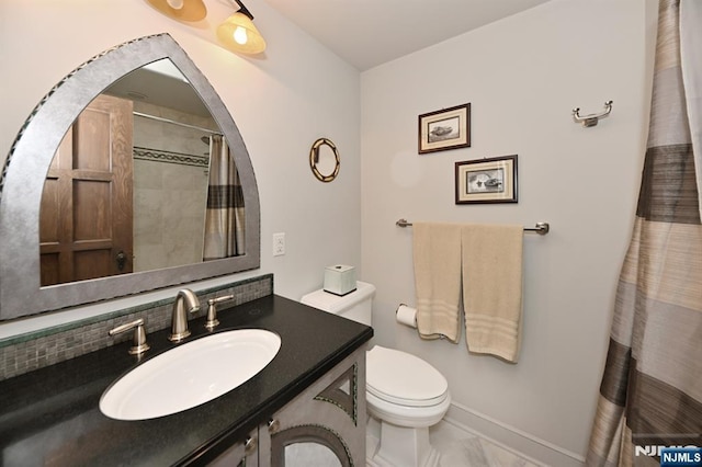 bathroom featuring vanity, toilet, marble finish floor, baseboards, and a shower with curtain