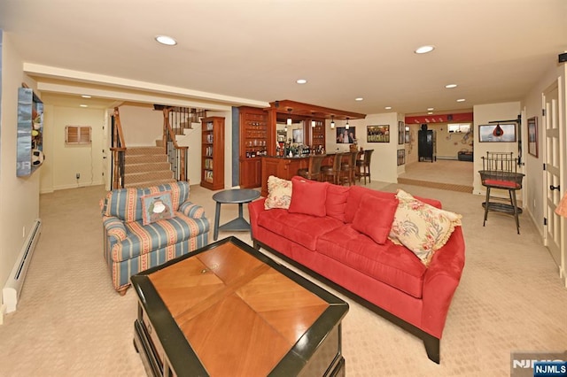 living room featuring stairs, a bar, a baseboard heating unit, light carpet, and recessed lighting