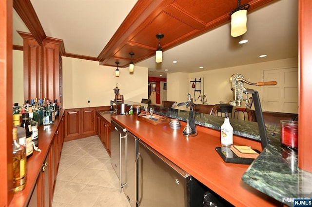 kitchen with pendant lighting, recessed lighting, light tile patterned flooring, and a sink