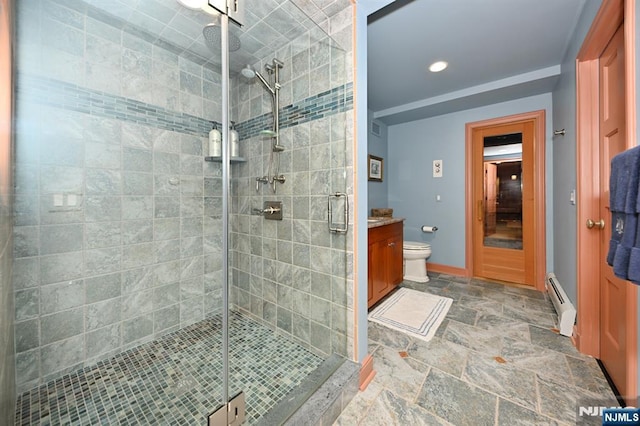 bathroom featuring vanity, baseboard heating, a stall shower, and recessed lighting