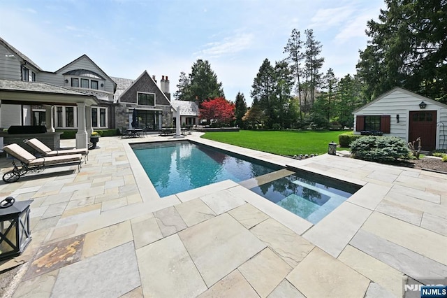 view of swimming pool with a lawn, a pool with connected hot tub, and a patio area