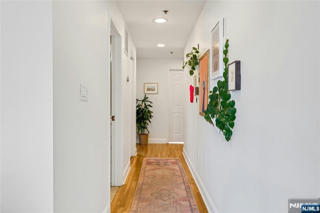 99 Park Ave Unit 5D, Hoboken, NJ 07030 - hall featuring light wood-style floors, recessed lighting, and baseboards