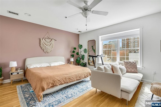 99 Park Ave Unit 5D, Hoboken, NJ 07030 - bedroom with baseboards, visible vents, ceiling fan, and light wood-type flooring
