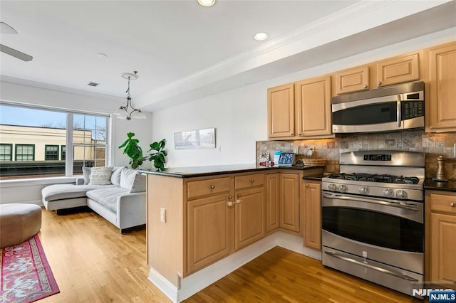 99 Park Ave Unit 5D, Hoboken, NJ 07030 - kitchen featuring decorative backsplash, crown molding, a peninsula, open floor plan, and stainless steel appliances