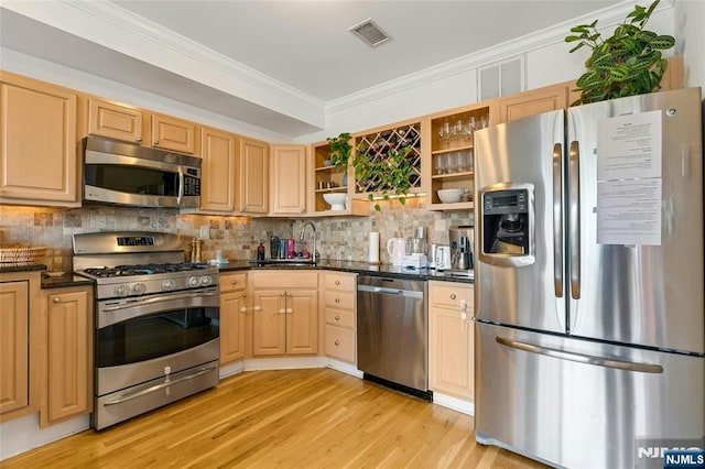 99 Park Ave Unit 5D, Hoboken, NJ 07030 - kitchen featuring decorative backsplash, crown molding, open shelves, light wood finished floors, and stainless steel appliances