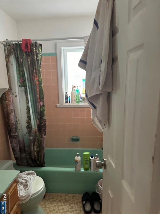 full bath with vanity, toilet, and shower / bathtub combination with curtain