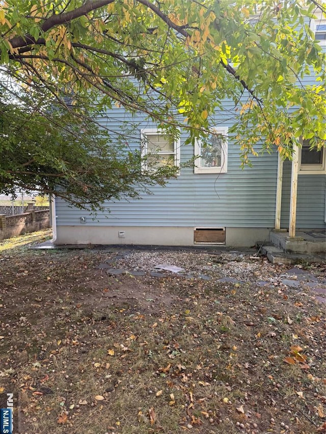 view of property exterior with fence