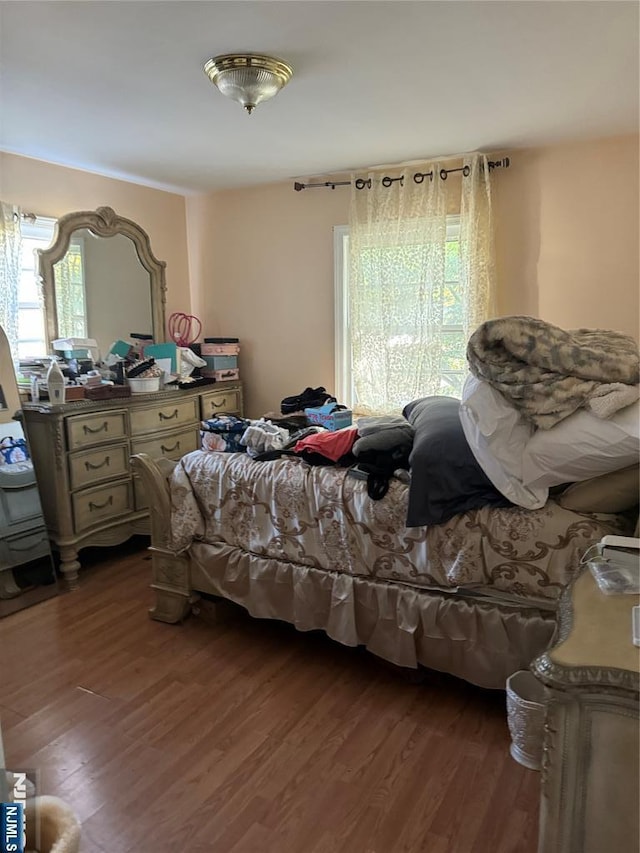 bedroom featuring dark wood-style floors