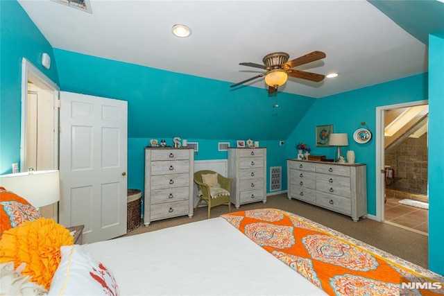 bedroom featuring visible vents, recessed lighting, carpet flooring, ensuite bath, and vaulted ceiling