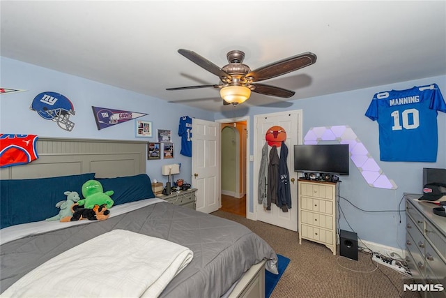 bedroom featuring carpet flooring, ceiling fan, and baseboards