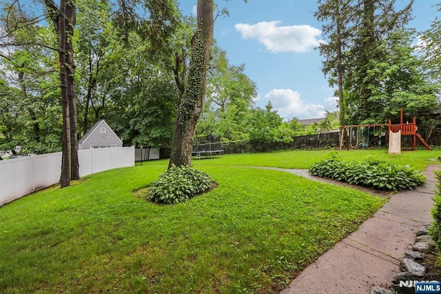 785 Ridgewood Rd, Twp Of Washington, NJ 07676 - view of yard with a trampoline and a playground