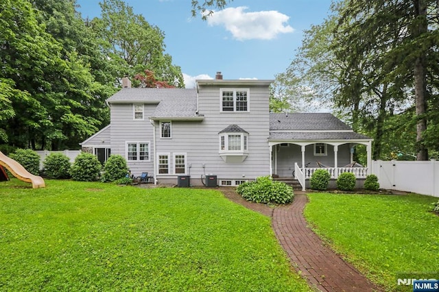 785 Ridgewood Rd, Twp Of Washington, NJ 07676 - rear view of house with covered porch, a chimney, a shingled roof, and central AC unit