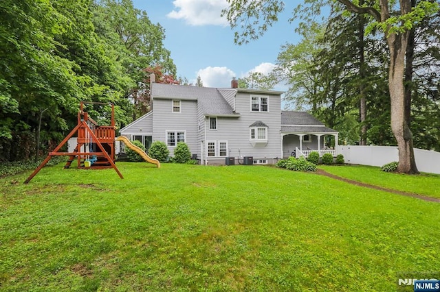 785 Ridgewood Rd, Twp Of Washington, NJ 07676 - rear view of property with a chimney, a playground, and central AC