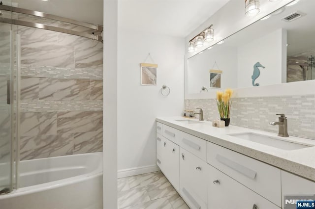 785 Ridgewood Rd, Twp Of Washington, NJ 07676 - bathroom featuring marble look tile flooring, double vanity, backsplash, shower / washtub combination, and baseboards