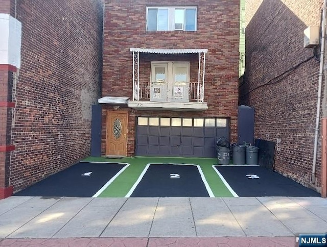 1215 Bergenline Ave, Union City, NJ 07087 - view of vehicle parking featuring a garage and driveway