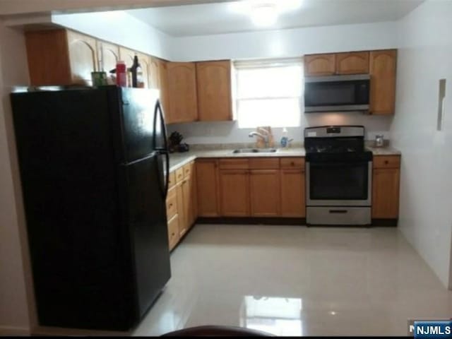 1215 Bergenline Ave, Union City, NJ 07087 - kitchen with stainless steel appliances, a sink, and light countertops