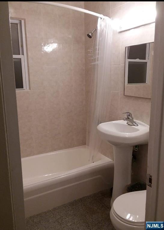 1215 Bergenline Ave, Union City, NJ 07087 - full bathroom with shower / bathtub combination with curtain, toilet, and tile walls