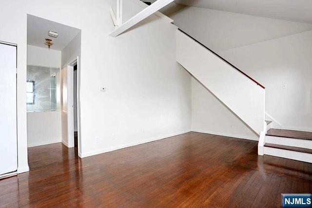 57 Brookway Ave Unit 2C, Englewood, NJ 07631 - interior space with baseboards, stairs, and wood finished floors