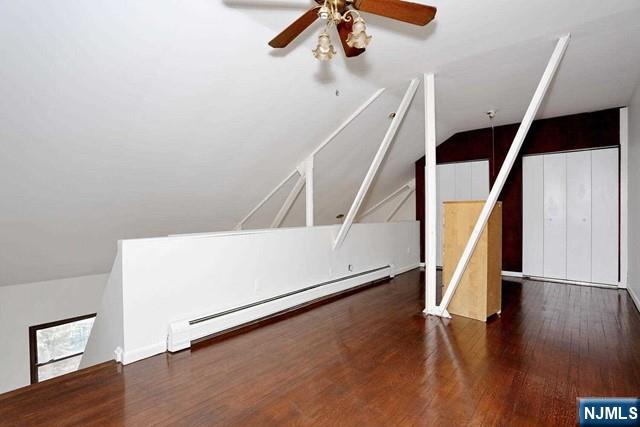 57 Brookway Ave Unit 2C, Englewood, NJ 07631 - bonus room featuring wood finished floors, ceiling fan, a baseboard heating unit, and vaulted ceiling