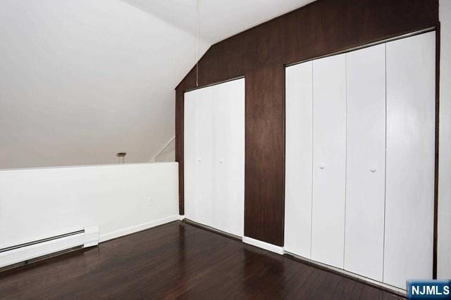 57 Brookway Ave Unit 2C, Englewood, NJ 07631 - additional living space with baseboard heating, dark wood-style flooring, and lofted ceiling