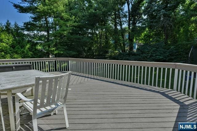 wooden deck featuring outdoor dining space