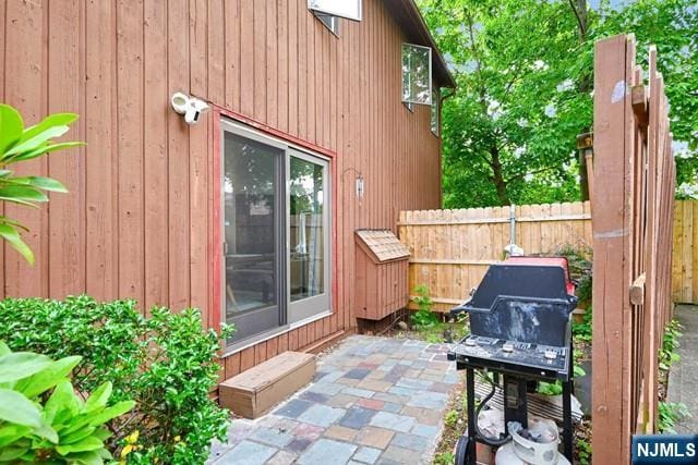 view of patio featuring fence