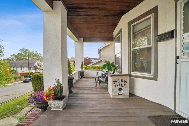 wooden deck with a porch