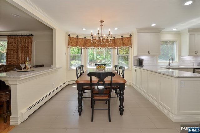 dining area featuring baseboard heating, a chandelier, crown molding, recessed lighting, and light tile patterned floors